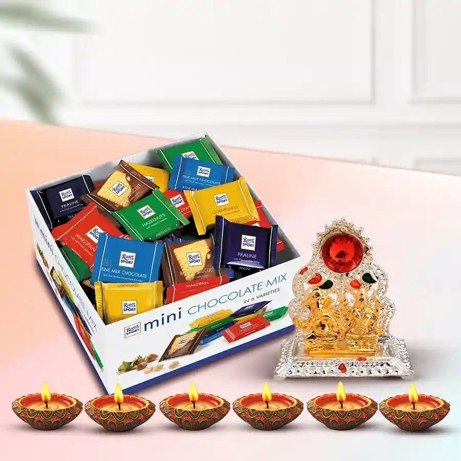 Ganesh Laxmi Mandap hamper featuring Ritter Sport mini chocolates and designer mud diyas for Diwali celebrations