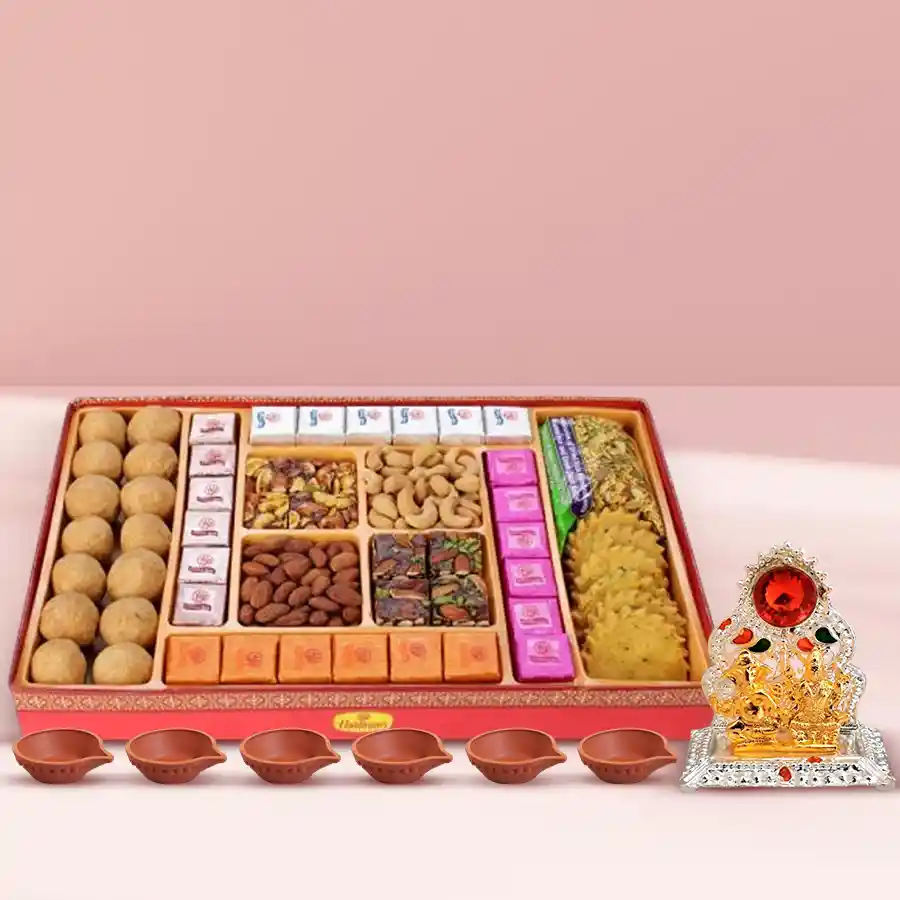 Exclusive Diwali sweet and dry fruit gift box with assorted sweets, handmade chocolates, premium cashews and almonds, antique Ganesh-Laxmi mandap, and a set of 6 decorated diyas.