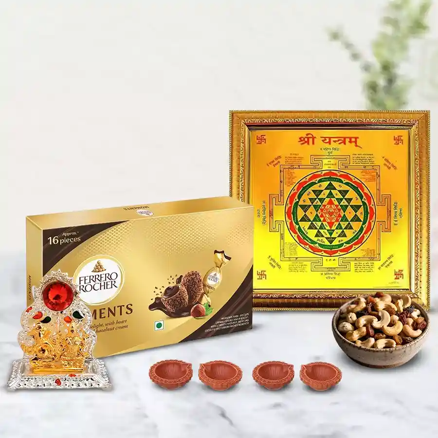 Exquisite Pooja Gift Combo for Diwali featuring gold-plated Shree Yantra, Ethnic Ganesh Laxmi Mandap, premium dry fruits, Ferrero Rocher chocolates, and decorative mud diyas