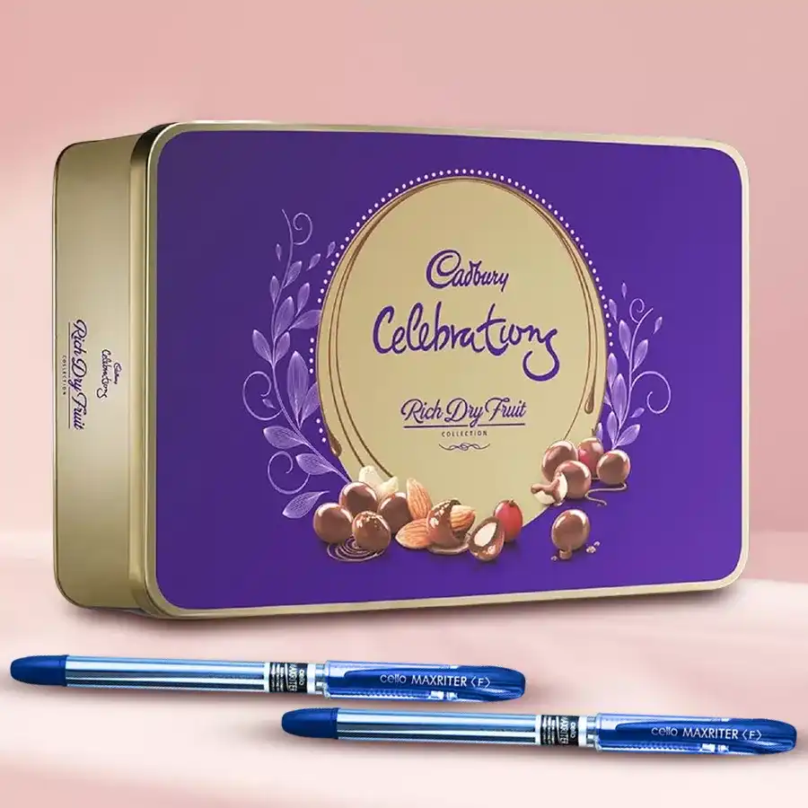 Cadbury Dairy Milk Rich Dry Fruit Box with two ballpoint pens displayed together