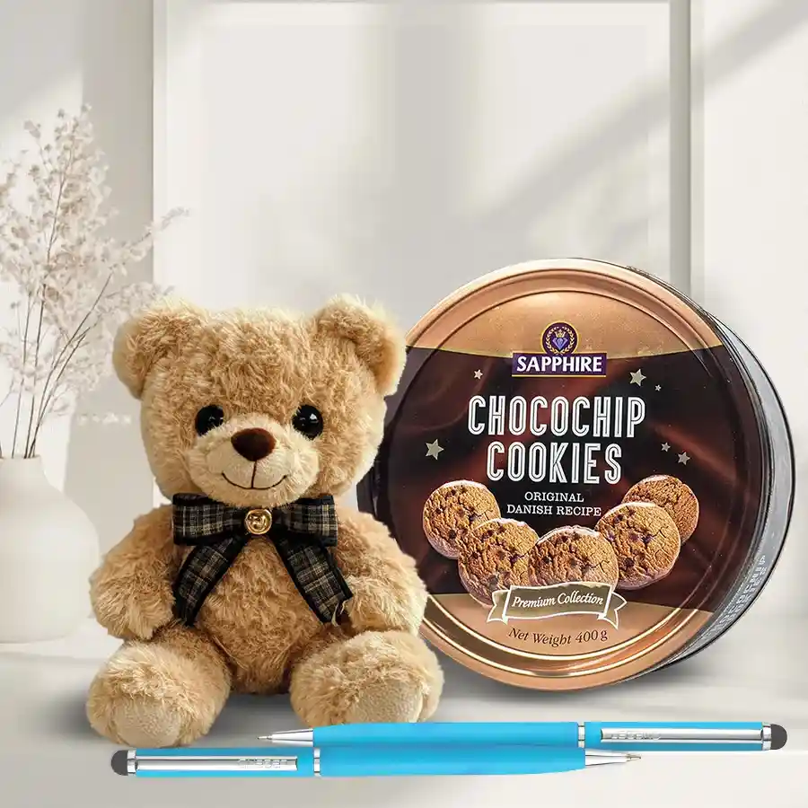 Delightful Chocochip Cookies N Assortments Combo featuring cookies, a teddy bear, and ballpoint pens arranged together.