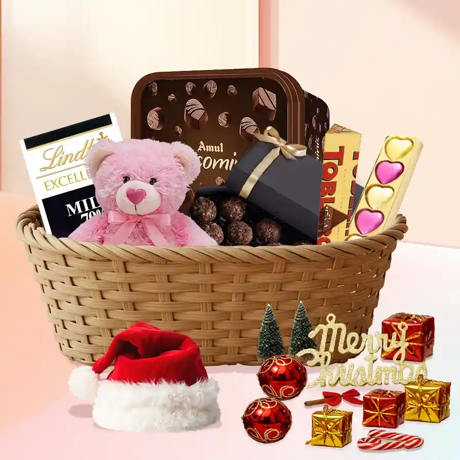 Exquisite Choco Gift Basket with teddy bear, Toblerone, Lindt Excellence bars, heart-shaped chocolates, homemade goodies, Amul Choco Minis, Santa Claus cap, and festive decorations