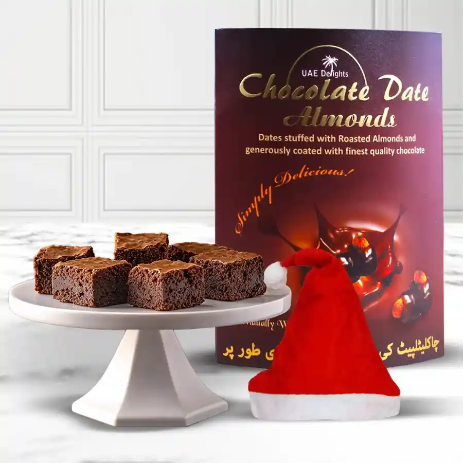 Exclusive Chocos Pack with date and almond chocolates, brownies, and a Santa Claus cap on a festive background.