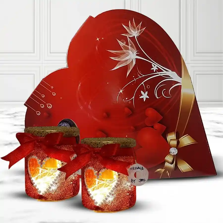 Smart LED lamp next to heart-shaped chocolates in a romantic gift presentation