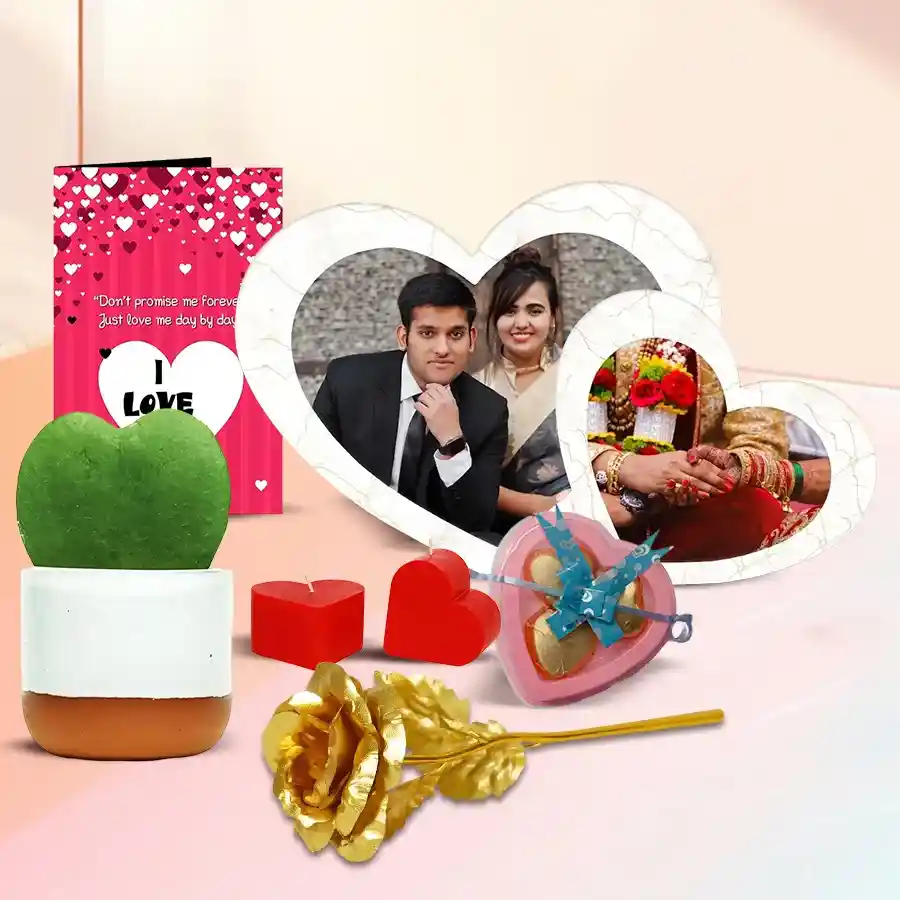 Valentine's Day gift bundle including a twin heart photo frame, heart-shaped plant, handmade heart chocolates, golden rose, "I Love You" message card, and heart-shaped candles