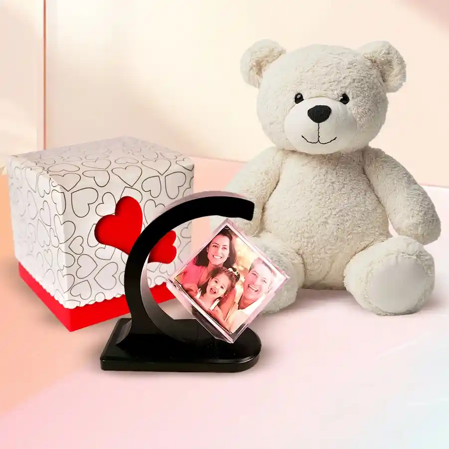 Personalized photo gift selection for boyfriend including a photo magnetic revolving stand, cute love teddy bear, and heart cutout handmade chocolate box.