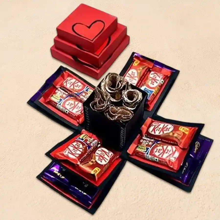 Admirable Valentine Special Explosion Box featuring Cadbury Dairy Milk chocolates, Nestle KitKats, fresh roses, and a decorative design.