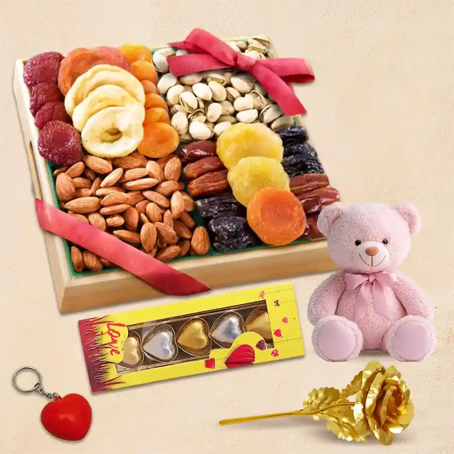 Valentine hamper with dry fruits, golden rose, heart chocolates, heart-shaped keyring, and teddy bear