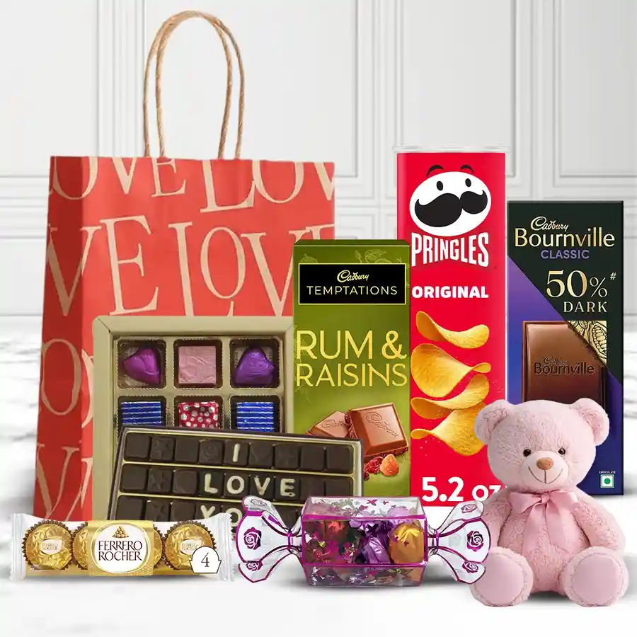 Remarkable Chocolate Assortments Hamper with Velvet Rose, featuring an assortment of chocolates, chips, and a red velvet rose in a Valentine's gift bag