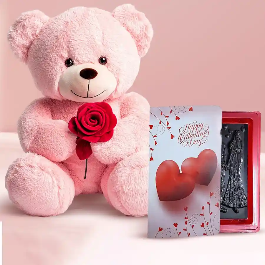 A cuddly 40 cm teddy bear holding a beautiful rose, a handmade Love Book, and a box of delicious chocolates, arranged as a charming gift set for Rose Day.