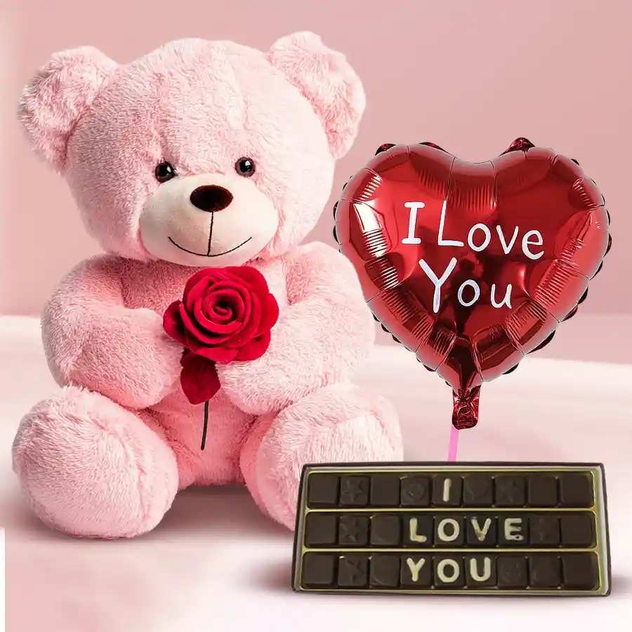 A 40 cm Big Teddy holding a rose, a pack of handmade chocolates with "I Love You" messages, and a vibrant "I Love You" Mylar balloon arranged beautifully for Valentine's Day.