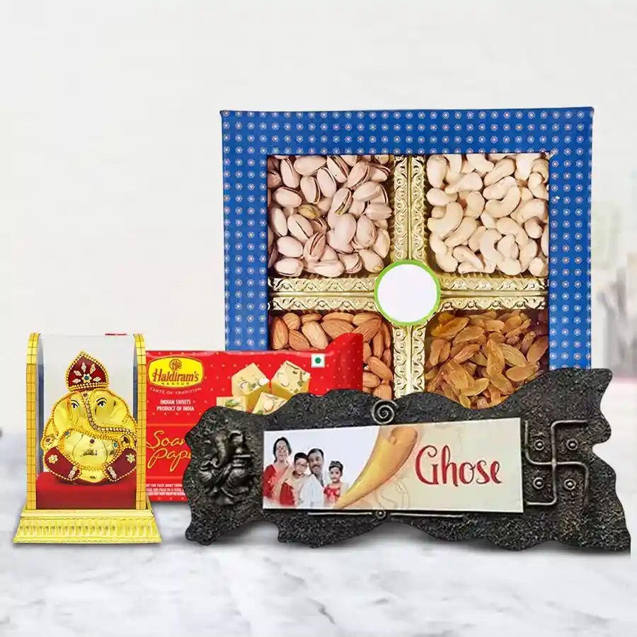 Marvelous Marriage Anniversary Gift Combo featuring a handcrafted Name Plate, assorted dry fruits, Vighnesh Ganesh Idol, and Haldiram Soan Papdi.