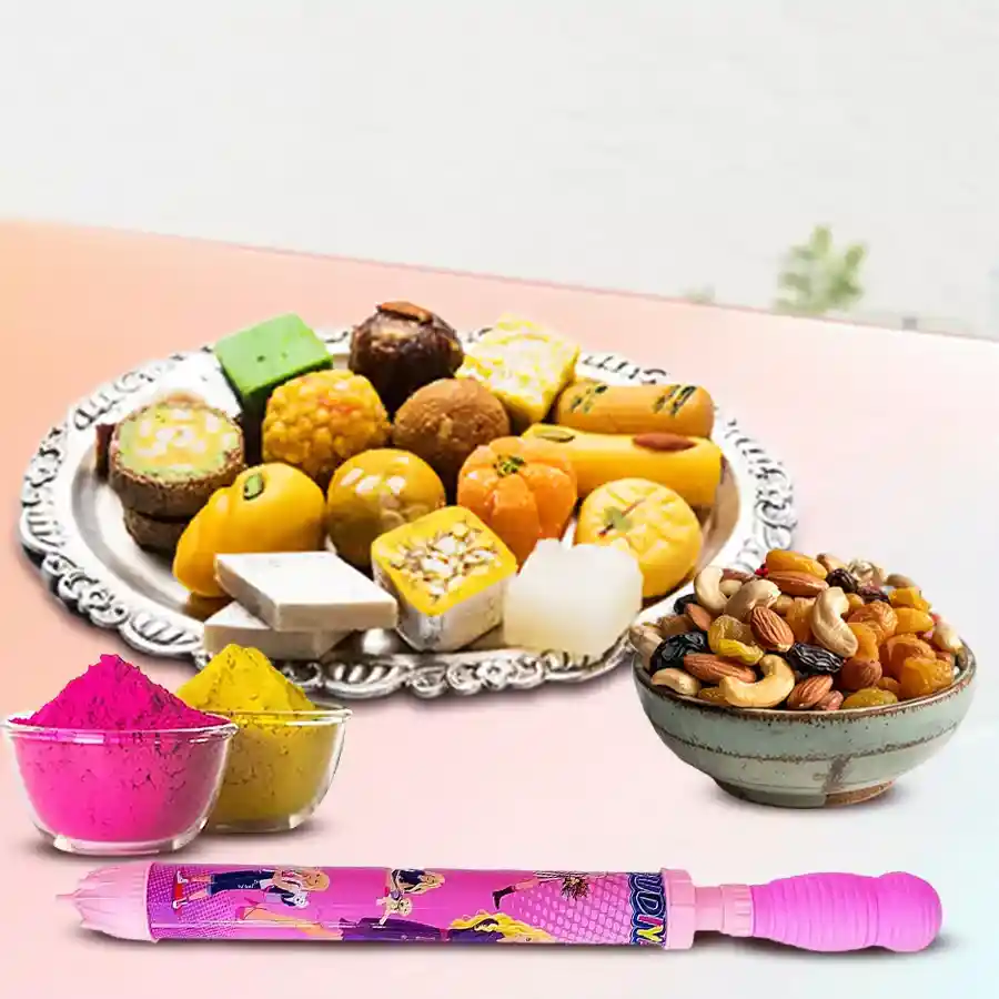 Yummy Assorted Sweets and Dry Fruits Gift Combo for Holi featuring assorted sweets, mixed dry fruits, a vibrant pichkari, and colorful herbal gulal.