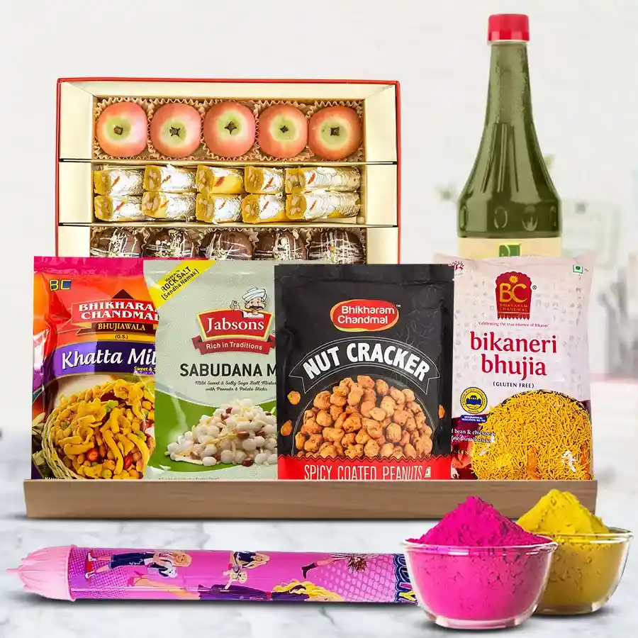 Enticing Munches Gift Hamper for Holi featuring colorful treats, a vibrant Pichkari, and herbal gulal arranged in a decorative tray