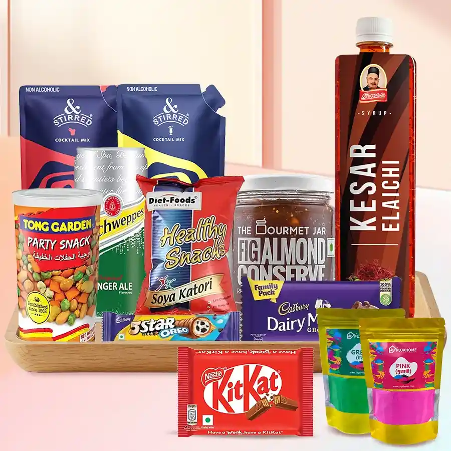 Colorful assortment of snacks, drinks, and chocolates in a wooden tray, celebrating Holi festivities.