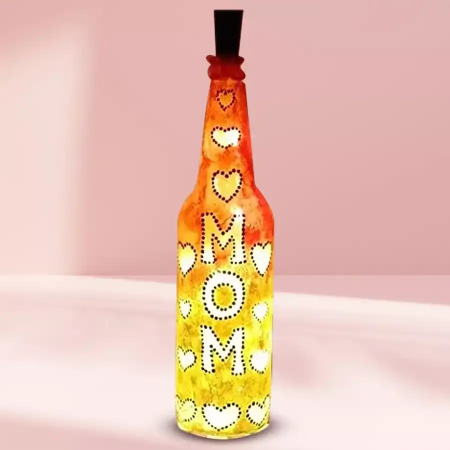 Elegantly handcrafted LED bottle lamp designed as a gift for mom, featuring a warm glow in a charming setup.