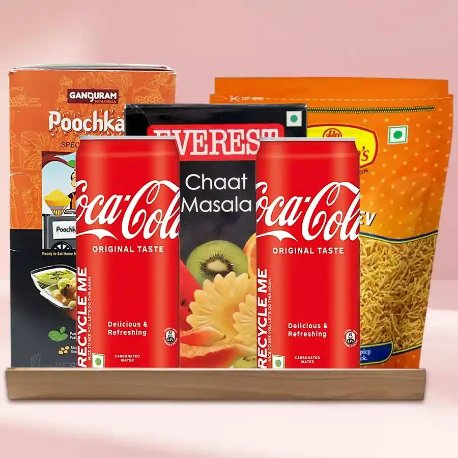 Puchka Golgappa Pani Puri Gift Hamper featuring Puchka pack, Chaat Masala, Sev Bhujiya, Coca-Cola cans, and a wooden tray