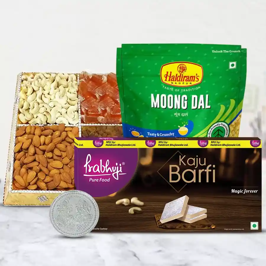 Haldiram Snacks and Sweets hamper with dry fruits and a silver-plated Laxmi Ganesh coin in a sturdy cardboard tray