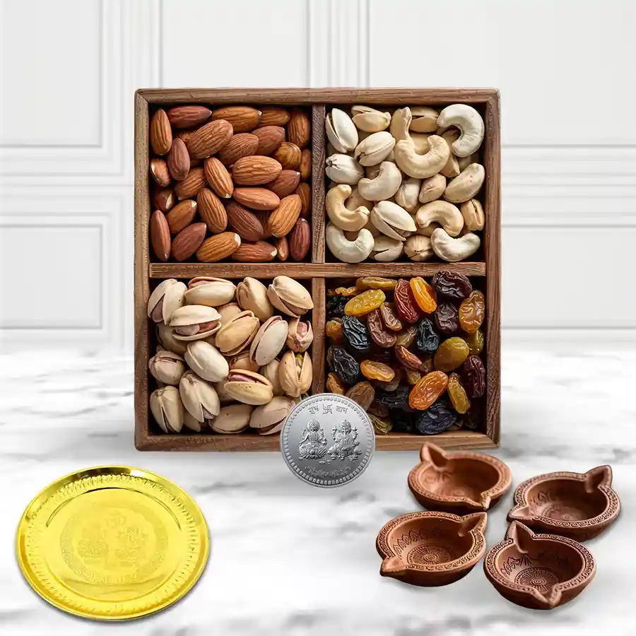 Crunchy Dry Fruits Mix set with gold-plated thali, four terracotta diyas, and a silver-plated Laxmi Ganesh coin, ideal for Diwali celebrations.