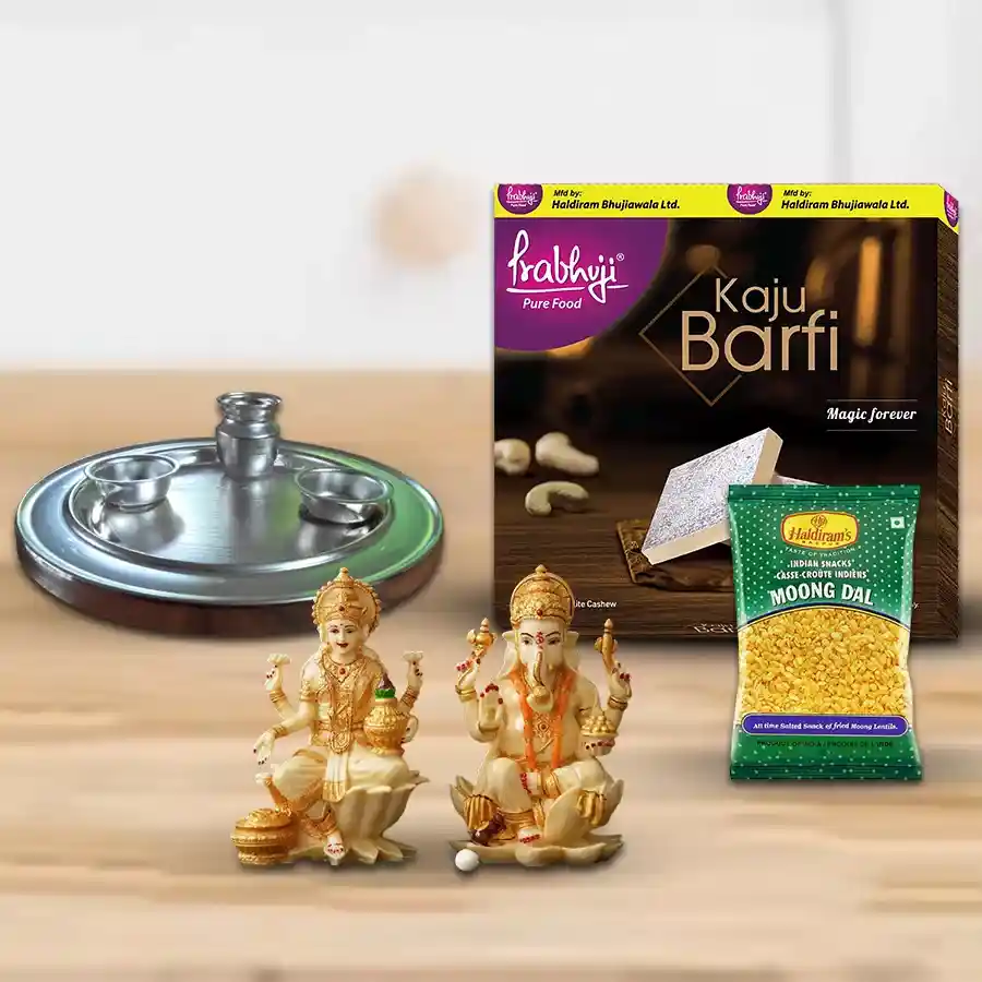 Finest Pooja Thali gift set featuring a silver-plated thali, Haldiram Khaju Barfi snacks, Haldiram Moong Dal Fried, and a Laxmi Ganesh idol, elegantly arranged for Diwali celebrations.