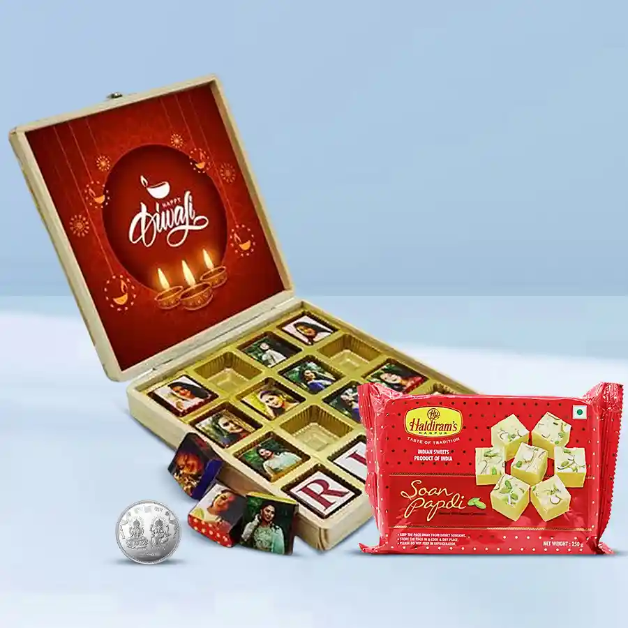 A personalized gift box featuring custom chocolates, Haldiram Soan Papdi, and a silver-plated Laxmi Ganesh coin, all arranged for a festive Diwali celebration.