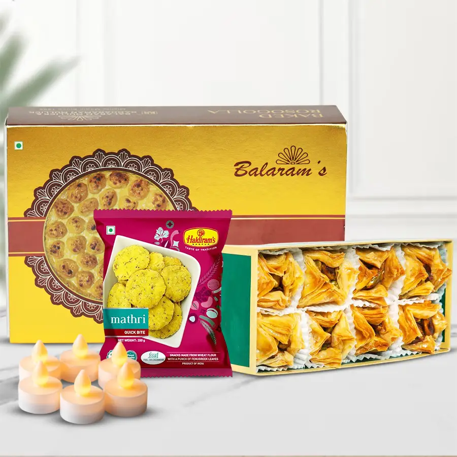 Lovely Diwali combo featuring assorted sweets and snacks with free LED tea light candles