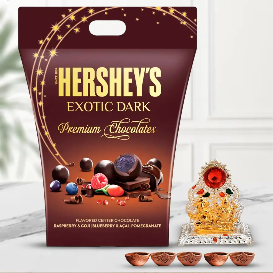 Pious Laxmi Ganesh Mandap set with Hershey's Dark Chocolate and five Mud Diyas arranged for Deepavali celebration