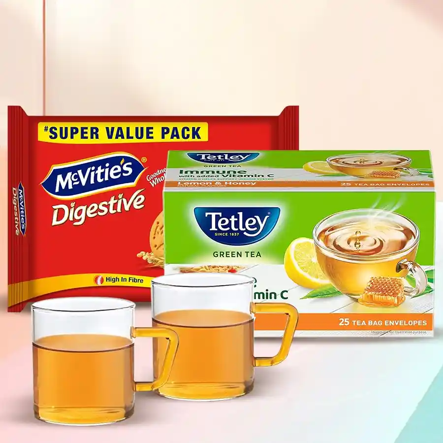 Superb Green Tea Hamper featuring green tea, McVitie’s Digestive High Fibre Biscuits, and a Borosil mug.