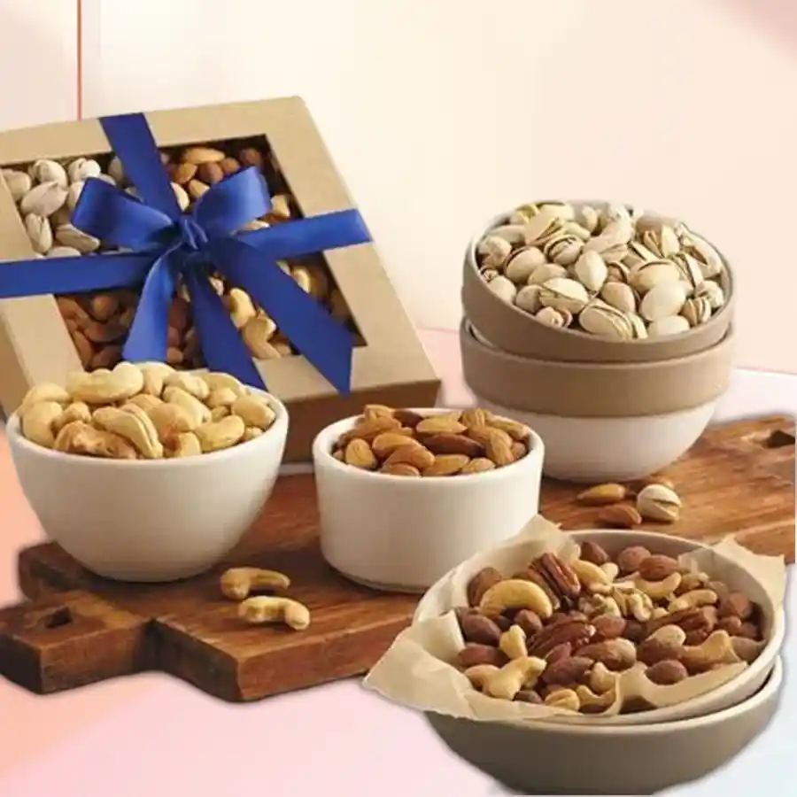 Pine wood box filled with an assortment of dried nuts including almonds, cashews, and pistachios, set in a festive arrangement for Christmas.