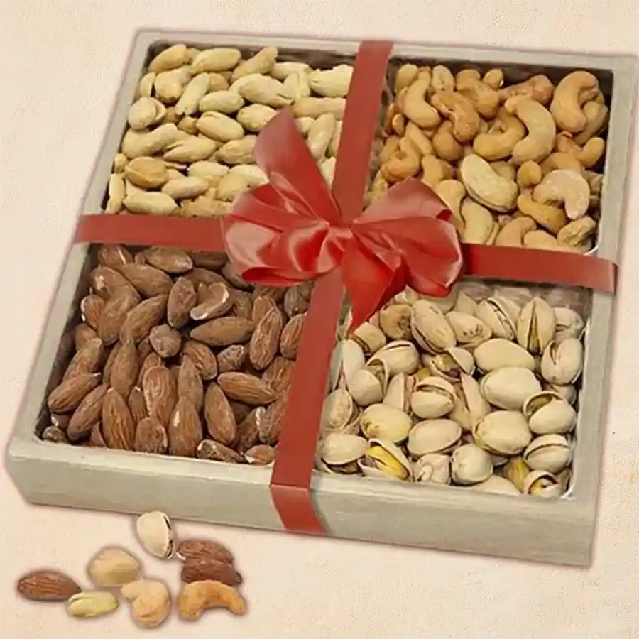Enchanting wooden tray filled with salted dry fruits including almonds, cashews, pistachios, and peanuts, surrounded by festive decorations.