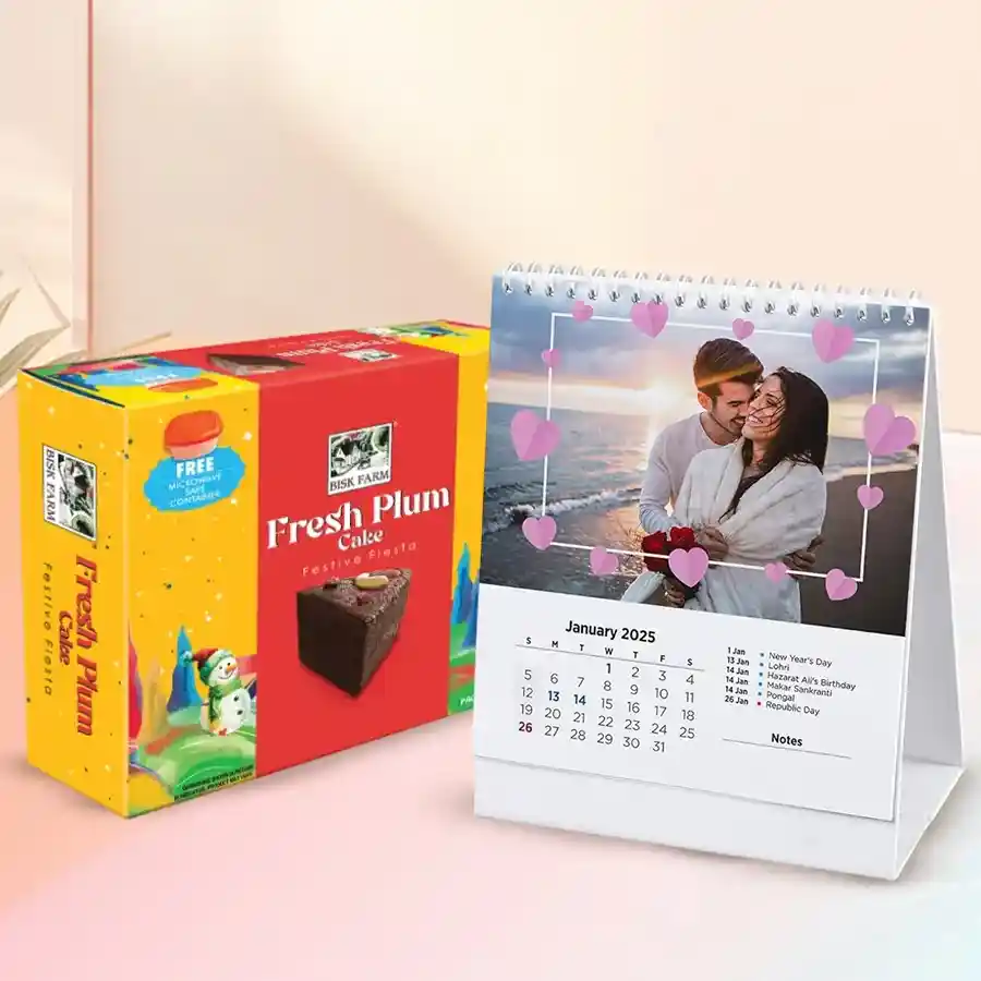 Personalized desk calendar with photographs and a plum cake, beautifully arranged as a Christmas gift.