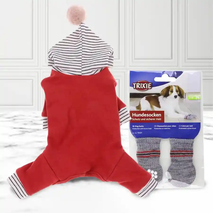 A festive bundle of red pet clothes, grey non-slip dog socks, and treats for Christmas, featuring a happy dog wearing the clothes and socks.