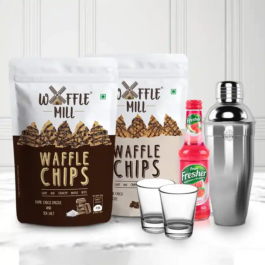 Terrific Christmas Hamper featuring Waffle Chips, Watermelon Strawberry Mocktail Mix, Stainless Steel Cocktail Shaker, and Shot Glasses