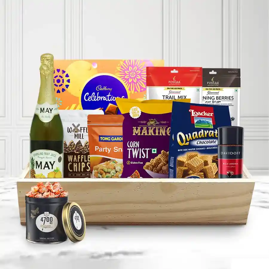 Special Gourmet Xmas Gift Basket filled with treats like Dark Choco Waffle Chips, Cadbury chocolates, gourmet popcorn, savory snacks, Davidoff coffee, sparkling juice, trail mix, and morning berries in a reusable wooden tray.