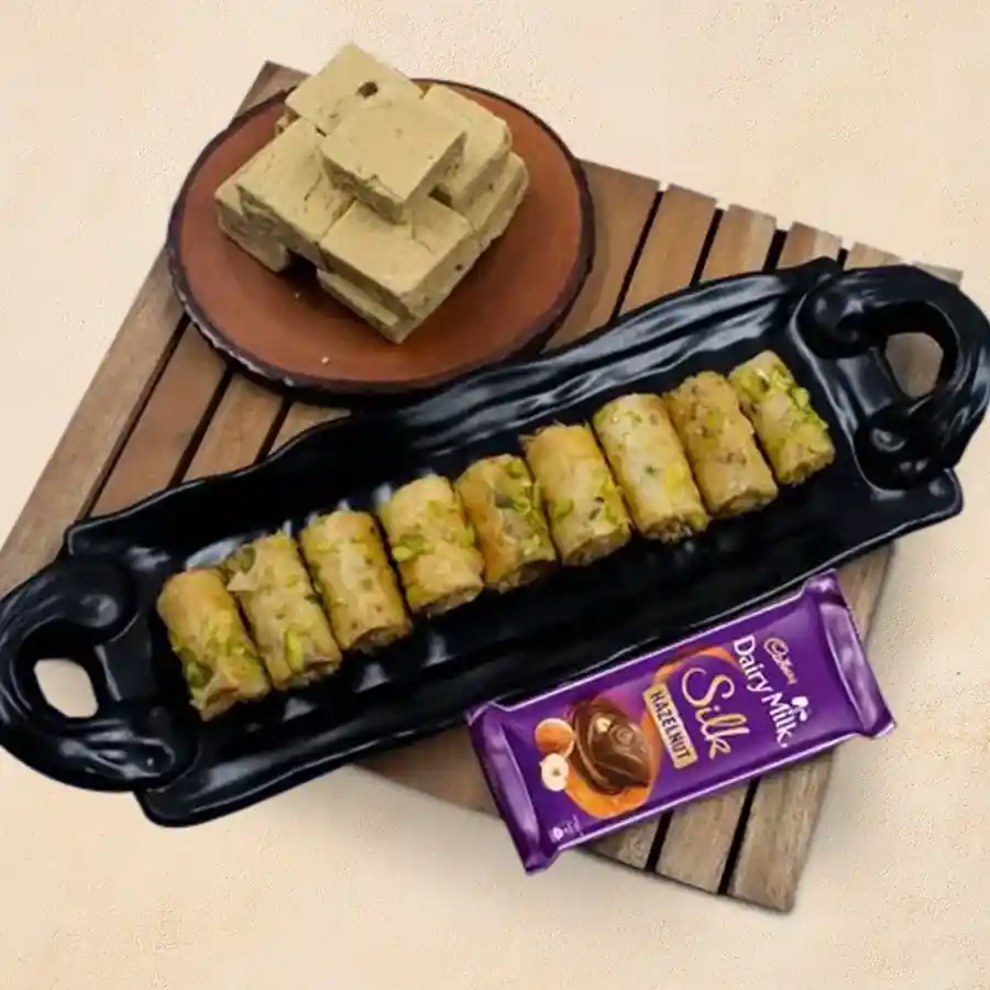Blissful selection of Roll Baklava with Cadbury Chocolate and Kaju Bite presented together