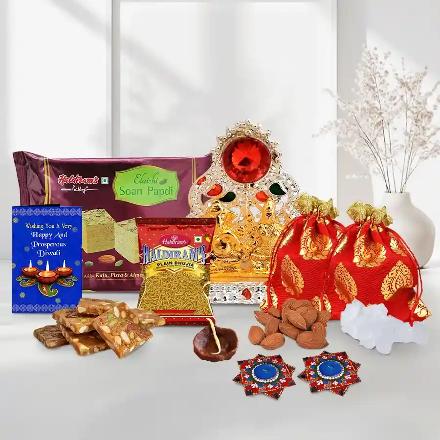 Magical Diwali Dhamaaka Sweets and Dry Fruits Gift Box with Haldiram’s Soan Papdi, crispy Bhujia, Dry Fruit Chikki, almond and mishri potlis, chocolate and dot mandala Diyas, Ganesh Lakshmi Mandap, and a Diwali card