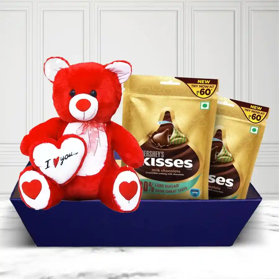 Impressive Hershey's Kisses Pair and a 6-inch teddy bear holding a heart arranged in a stylish square tray