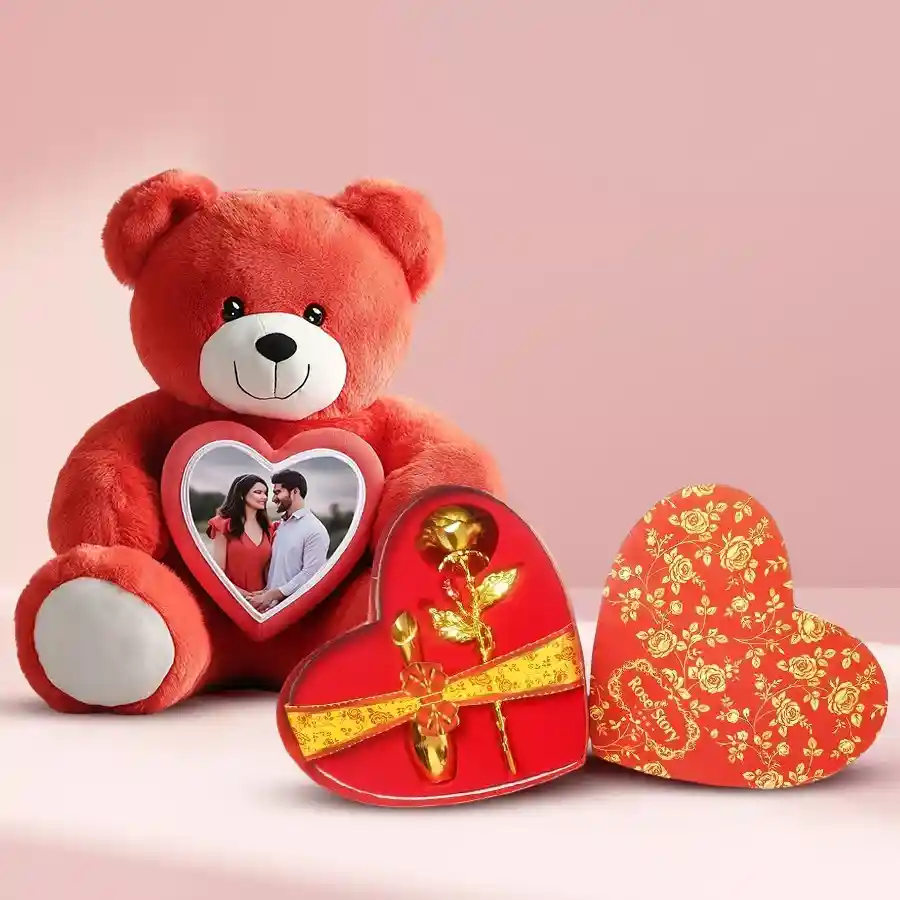 Personalized teddy bear holding a golden rose, beautifully presented in a heart-shaped box.