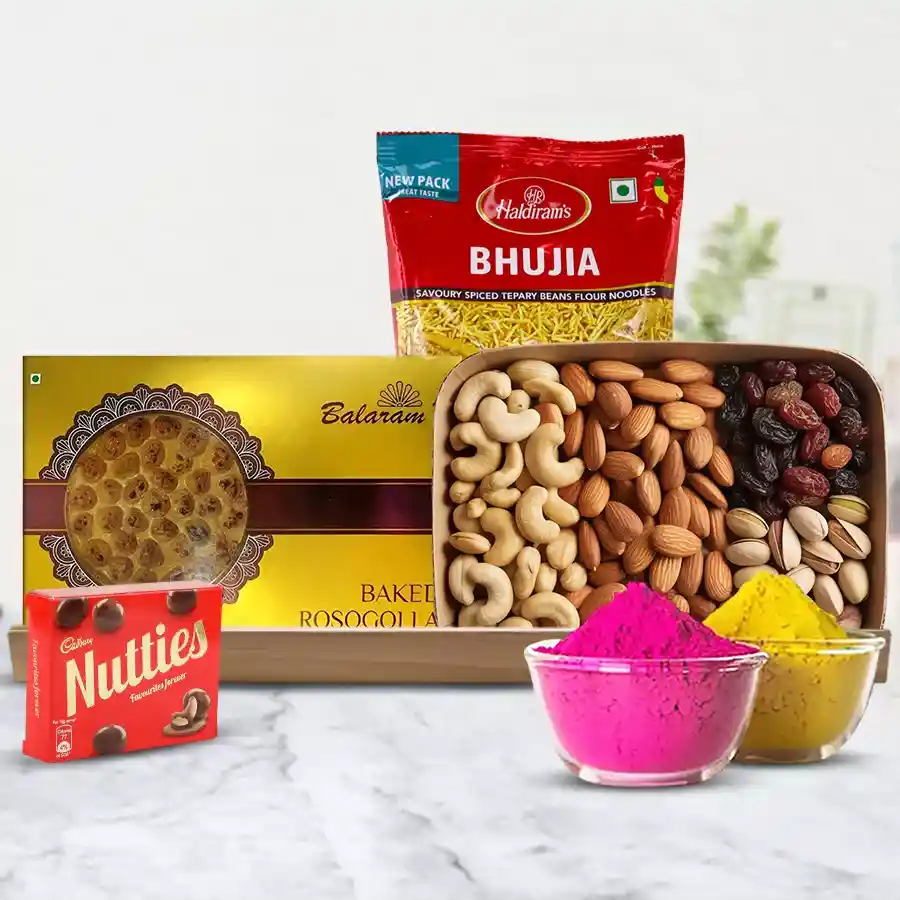 Exclusive Balaram Mullick Sweets n Dry Fruits Gift Combo featuring Baked Rasgulla, cashews, almonds, raisins, pistachios, Cadbury Nutties Chocolate, Haldiram Bhujia, gulal-free colors, arranged in a wooden tray.