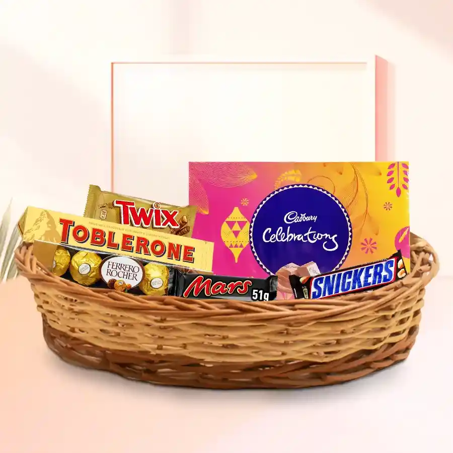 Amazing Chocolate Gift Basket filled with Toblerone, Ferrero Rocher, Snickers, Twix, Mars, and Cadbury Celebration, beautifully presented in a charming basket.
