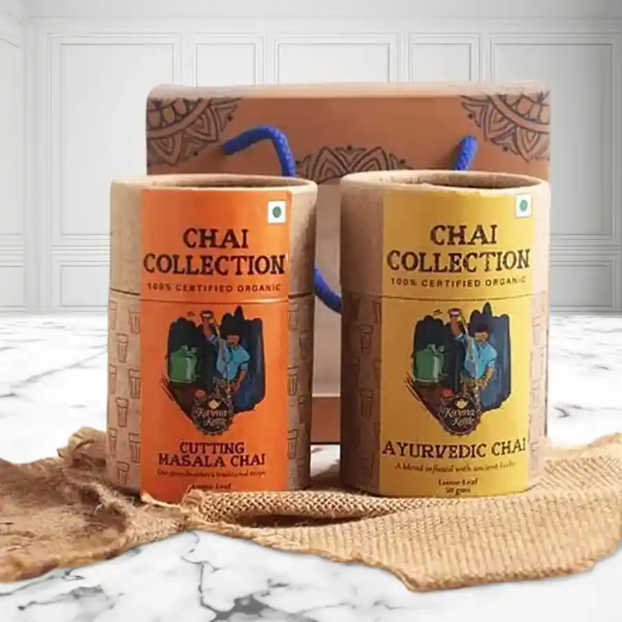 Indian Spice Chai Box with Ayurvedic Chai, Cutting Chai, and coconut spoon, beautifully packaged for gifting.