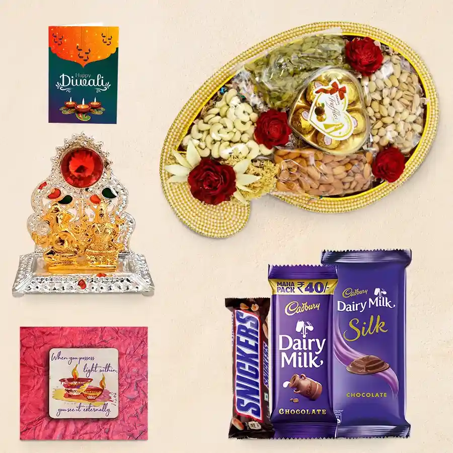 Diwali Bliss Gift Hamper featuring a decorative pearl tray with nuts and chocolates, Cadbury Dairy Milk Silk and Snickers bars, a Ganesh-Laxmi Mandap, a handmade Happy Diwali fridge magnet, and a wishing card.
