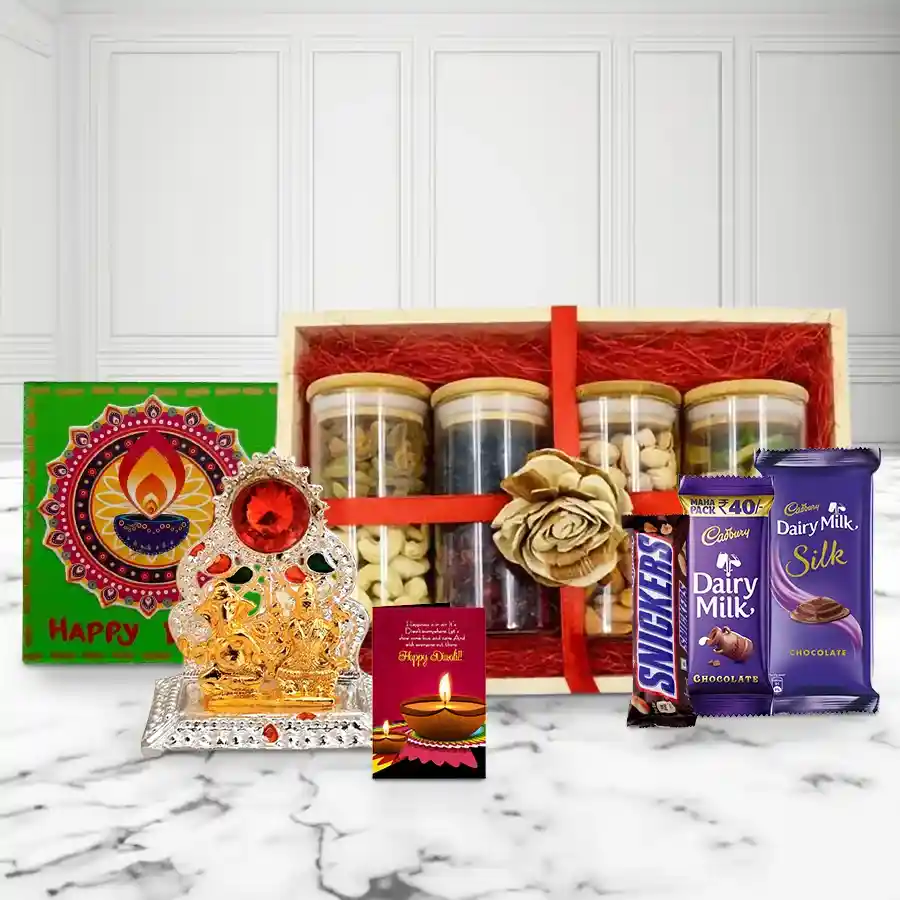 Extravagant Diwali gift hamper featuring a wooden tray filled with premium nuts, Cadbury chocolates, Snickers, a Ganesh-Laxmi Mandap, a handmade fridge magnet, and a heartfelt Diwali card.