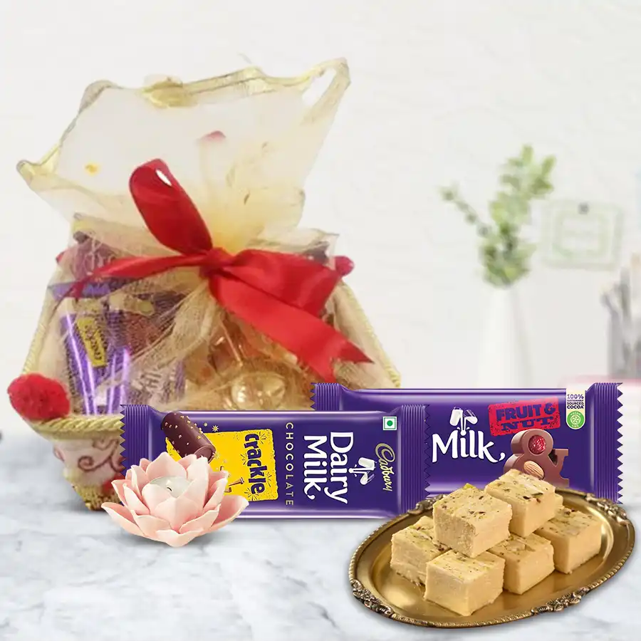 Yummy Sweets and Chocolates Combo with Lotus Tea Lights in a decorative basket for Diwali celebrations