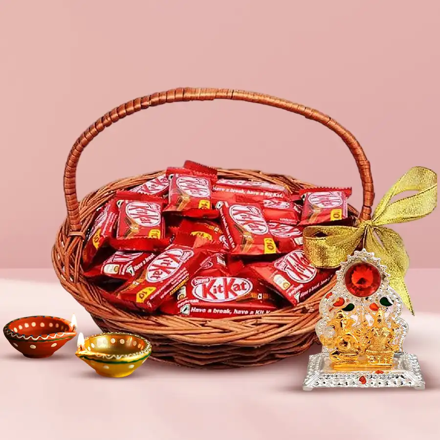 Special KitKat Chocolates and Festive Decor Hamper featuring KitKat Chocolate Fingers, decorated wax diyas, Ganesh-Laxmi mandap, and a decorative gift basket.