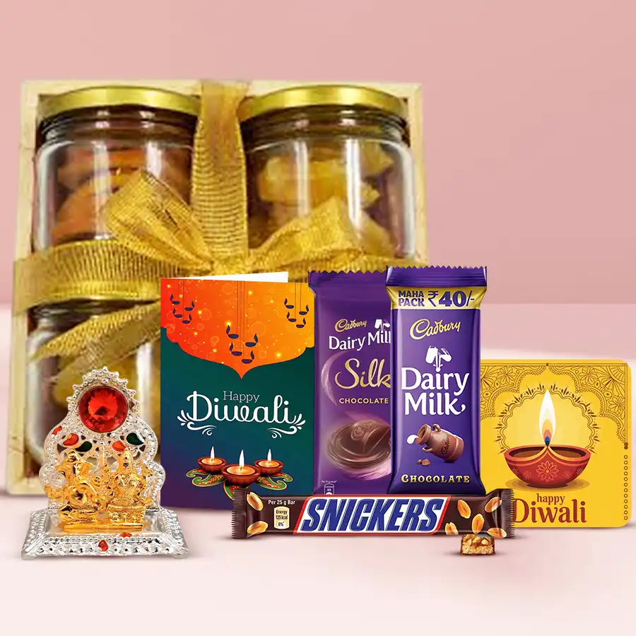 Royal Diwali Wishes Hamper featuring a wooden tray with dried orange and pineapple slices, Cadbury Silk and Snickers, a Ganesh Lakshmi Mandap, a handmade fridge magnet, and a personalized greeting card.