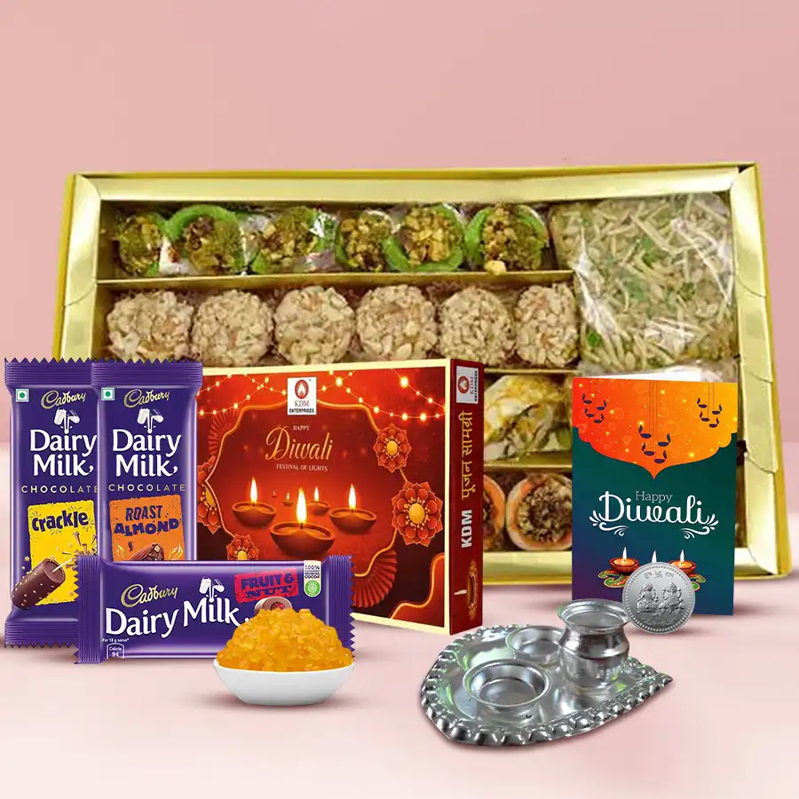 Abundant Diwali Time Gift Hamper with assorted kaju barfis, Cadbury chocolates, silver pooja thali, Ganesh coins, pooja samagri, and a Diwali card.