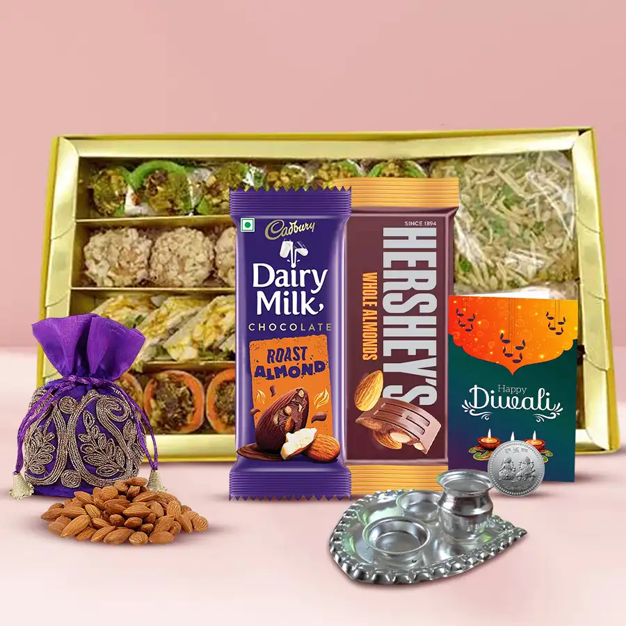 Gift of Gratitude Diwali Hamper featuring sweet treats, chocolates, a silver-plated Ganesh Lakshmi coin, a Pooja Thali, and festive packaging