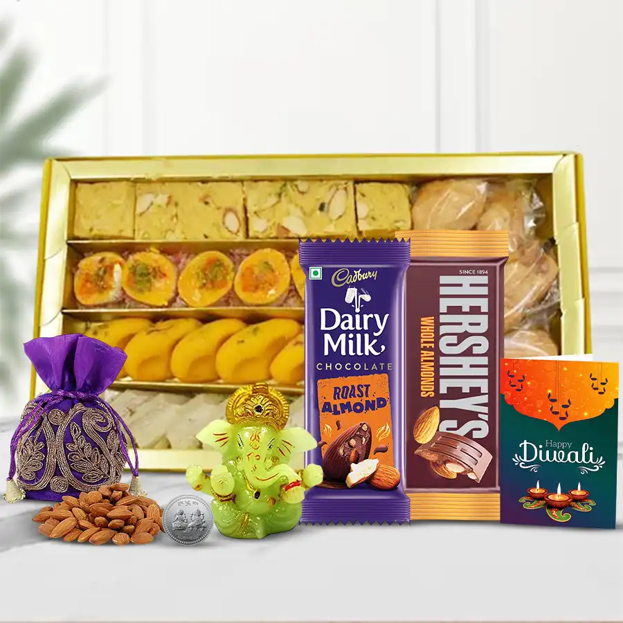 Festive Dazzle Diwali Gift Box featuring assorted sweets, snacks, Cadbury and Hershey’s chocolates, a glowing Ganesh idol, a shiny Ganesh Laxmi coin, an almond potli, and a Diwali card.