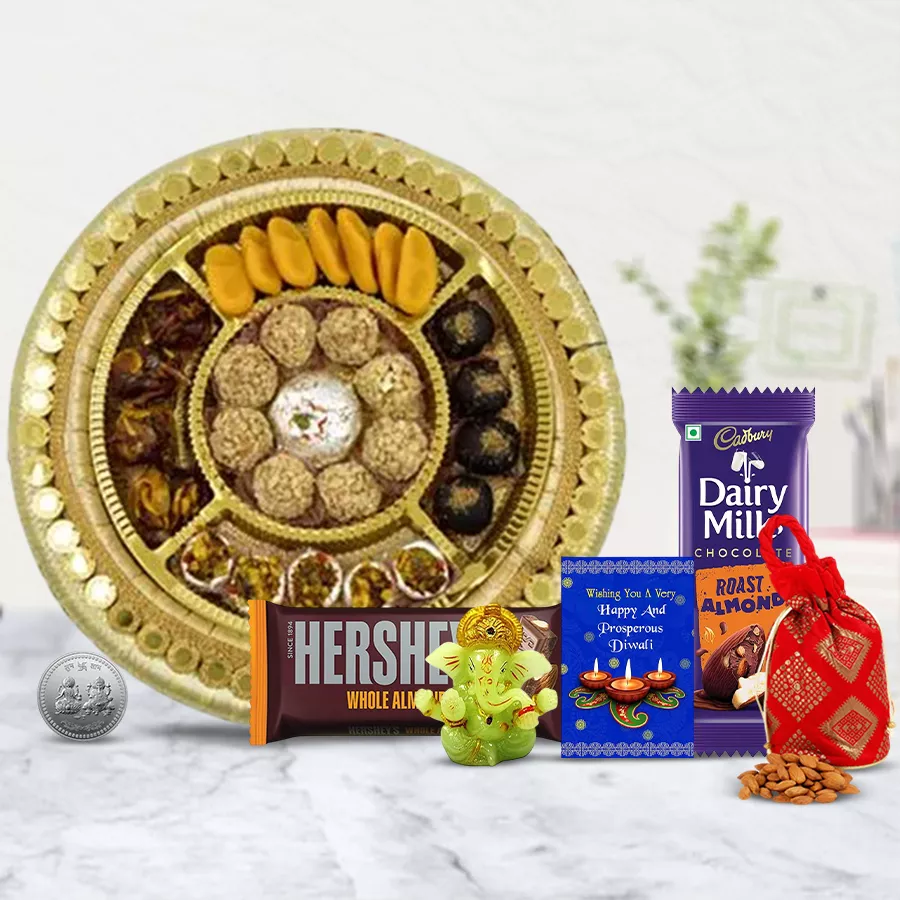 City Delight Festive Gift Hamper featuring traditional sweets, chocolates, a silver Ganesh Laxmi coin, a glowing Ganesh idol, almond potli, and a Diwali card